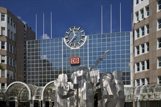 A stainless steel figure group at the main railway station entitled The Ring by Horst Antes,