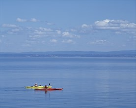 Sea Kayakers on Saint-Lawrence River in summer, Port-au-Persil, Charlevoix, Quebec, Canada, North