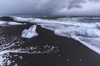 Ice floes on the beach, snowy, waves, sea, clouds, winter, Diamond Beach, Breidamerkursandur,