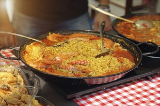 Paella preparation, street market stand near Barcelona Cathedral square