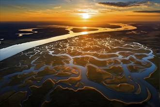 Aerial view capturing the geometric patterns of a river delta in vibrant hues, AI generated