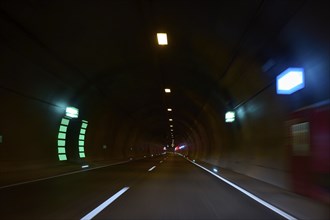 Motorway tunnel A71 with illuminated road and modern light installations offering a perspective