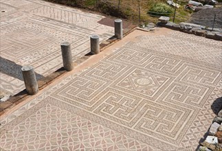 Historic mosaic floors of an open-air archaeological site show geometric patterns, Messene, ancient