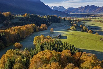 Aerial view of a mountain landscape in autumn, trees, morning light, view of Zugspitze and Bavarian