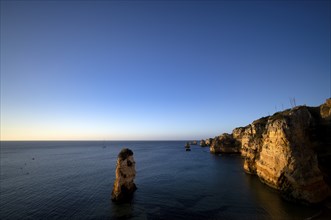 Colourful cliffs and rocks at sunrise on the beach, Praia da Dona Ana, Lagos, cliffs, Atlantic