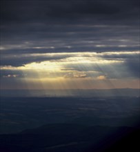 Sunbeams break through clouds, taken during the landing approach in Frankfurt am Main