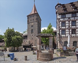 Tiergärtnertorplatz with Tiergärtnertor tower, medieval draw well and Pilatushaus, Nuremberg,