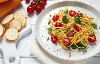 Yellow zucchini salad, with cherry, vegetarian food, sliced into strips, homemade