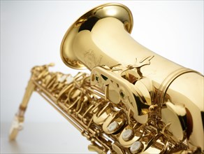 Saxophone in front of white background, detail, studio shot