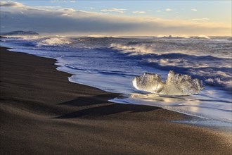 Ice floes on the beach, waves, sunny, morning mood, winter, Diamond Beach, Breidamerkursandur,