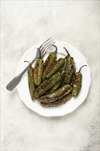 Fried padron pepper, in a frying pan, with olive oil, and sea salt, homemade, no people