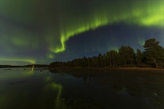 Northern lights, (Aurora borealis) at a lake near Kiruna, September 2024, Lapland, Sweden, Europe