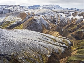 Early snow on the colorful rhyolite mountains, Landmannalaugar, Fjallabak Nature Reserve, Iceland,