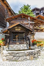 Fountain house in the historic village centre, Grimentz, Val d'Anniviers, Valais Alps, Canton