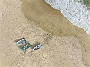 Boats at the shore of the Atlantic Ocean near Bolonia. Aerial view. Drone shot. Cádiz province,