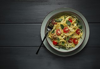 Yellow zucchini salad, with cherry, vegetarian food, sliced into strips, homemade