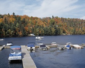 Boats moored at Lac Masson Marina in autumn, Lanaudiere, Quebec, Canada, North America