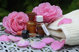 Rose oil, rose petals and rose oil in vials