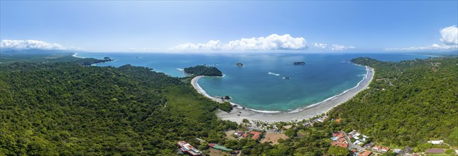 Aerial view, coast and town, Corrohoe Bay and Playa Espadilla, Manuel Antonio National Park,