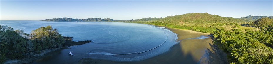 Aerial view of an extensive coastal region with beach and wooded hills, Pochote, Puntarenas, Costa