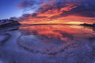 Dawn over an icy fjord, mountain landscape, fisheye shot, Breiddalsvik, East Fjords, Iceland,