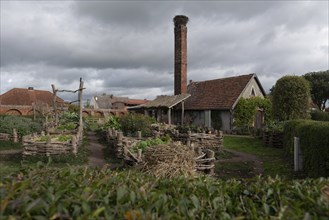 Monastery garden with stork's nest, Jerichow Monastery, considered the oldest brick building in