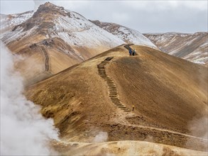 Steaming hot springs and colourful rhyolite mountains, hiking path, Hveradalir geothermal area,