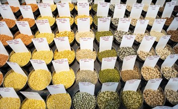 Samples of pulses kept on display inside a shop at a wholesale market ahead of the presentation of