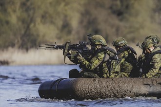 Soldiers on an inflatable boat, taken as part of the military exercise 'Wettiner Schwert' with