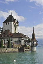 The water castle Schloss Oberhofen along the Tunersee, Lake Thun in the Bernese Alps, Switzerland,