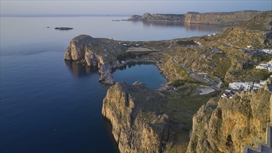 Drone shot, first morning light, Lindos, Acropolis of Lindos, Aerial view of a quiet coastal