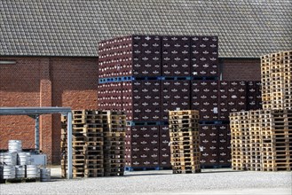 Stacked beer crates at trappist Abbey of Westmalle, Flemish monastery of Cistercians and brewery in