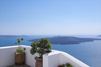 Terrace on the crater rim, in the background volcanic island Nea Kameni, Firà, Thira, Santorini,