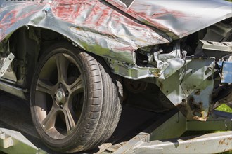 Damaged front end fender and hood on silver NIssan car, Quebec, Canada, North America