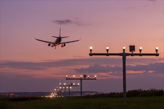 Passenger aircraft approaching, air traffic, after sunset, twilight, airport, Stuttgart,