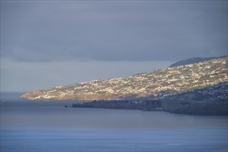 View of Funchal city and Madeira airport in the morning. Madeira, Portugal, Europe