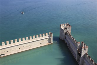 Harbour basin of the castle with flat Guelph battlements, Scaliger Castle, Castello Scaligero, in