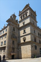 Historic baroque building under a blue sky with towers and decorations, cathedral, Praza das