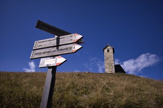 Signpost for hikers, Church of St. Vigil, Vigilius am Joch, Glaubensweg, near Lana, South Tyrol,