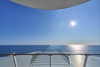 View from the ship's deck, Mein Schiff 6, of the vast sea under bright sunshine and blue skies,