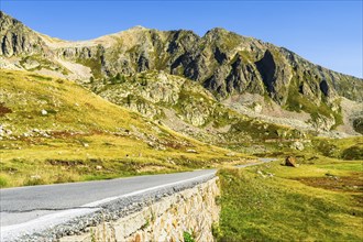 View of road and mountains at border pass Col dela Lonbarde (Colle della Lombarda), Italy and