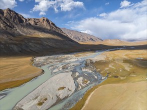 Aerial view, Burkhan mountain valley with meandering river, barren dramatic mountain landscape,