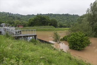 Symbolic image extreme weather, global warming, climate change, barrier, flood retention basin,