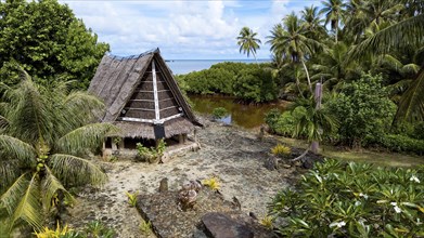 Traditional historical meeting house for men Tribal Chief Men Men's House between palm trees, in