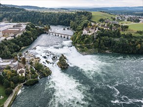 Aerial view of the Rhine Falls with railway viaduct and Laufen Castle in autumn, Neuhausen, Canton