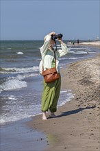 Elderly woman photographed on the beach, Darßer Ort, Born a. Darß, Mecklenburg-Vorpommern, Germany,