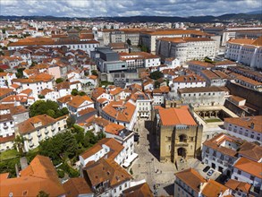 Central city view with old buildings and a striking historic church in the centre, aerial view,