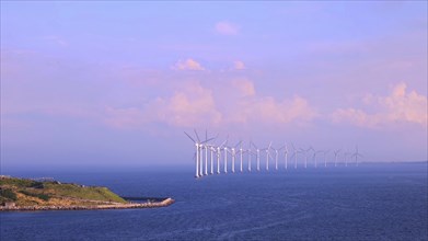 Renewable energy wind power plant and wind turbines along Denmark sea shoreline near Copenhagen