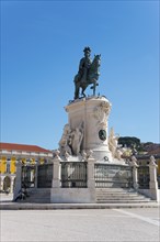 Large monument with an equestrian statue in a square under a clear blue sky, equestrian statue of