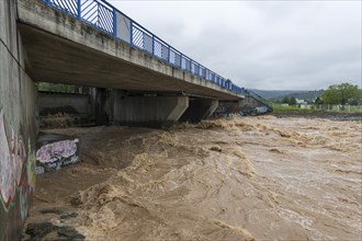 Symbolic image extreme weather, global warming, climate change, barrier, flood protection, bridge,